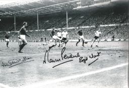 Jack Charlton, Martin Peters, Roger Hunt signed 12 x 8 inch b/w 1966 World Cup final football photo.
