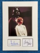 Star Wars Carrie Fisher and Dave Prowse autographs mounted with 10 x 8 inch photo to an overall size