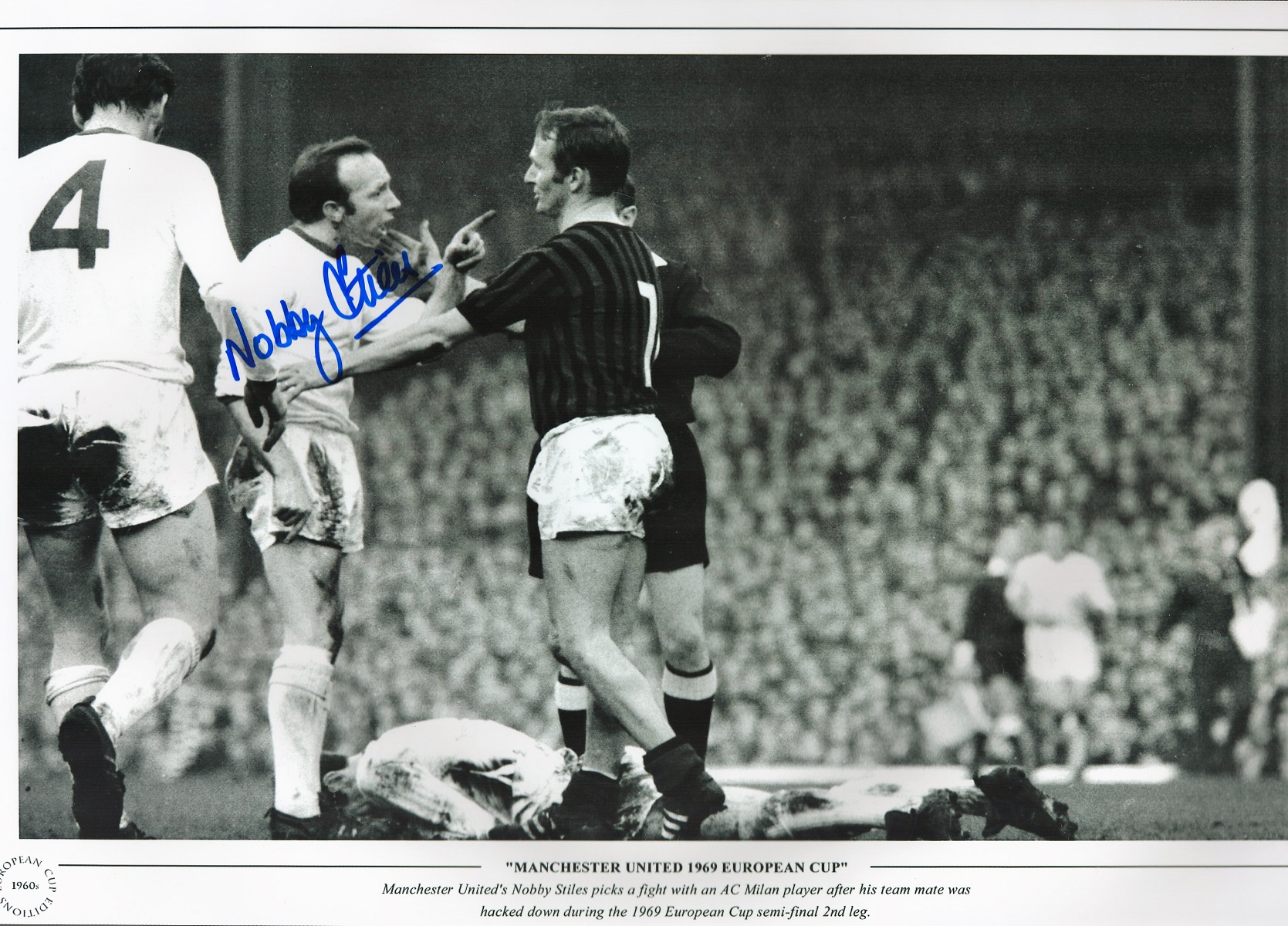 Football. Nobby Stiles Signed 18x12 black and white photo. Photo shows Stiles picking a fight with