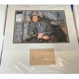 James Stewart signature piece mounted below colour photo. Approx overall size 14x14