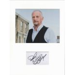 David Essex autograph mounted display. A Mounted with photograph to approx. 16 x 12 inches overall.