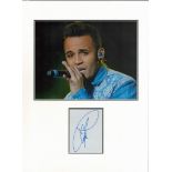Aston Merrygold (JLS) signature piece in autograph presentation. Mounted with photograph to approx.