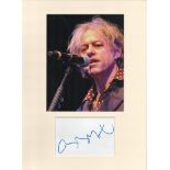 Bob Geldof signature piece in autograph presentation. Mounted with photograph to approx. 16 x 12 inc