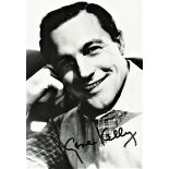 Gene Kelly signed 7x5 black and white photo.