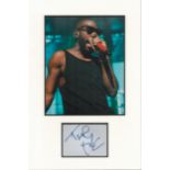Tinie Tempah signature piece autograph presentation. Mounted with unsigned photo to approx. 16 x