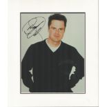 Donny Osmond signed 10 x 8 inch colour photo mounted to approx. 14 x 14 inches overall. Good