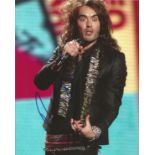 Russell Brand Signed 10 x 8 inch Colour Photo. Good condition. All autographs come with a