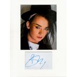 Boy George music signature piece autograph presentation. Mounted with unsigned photo to approx. 16 x