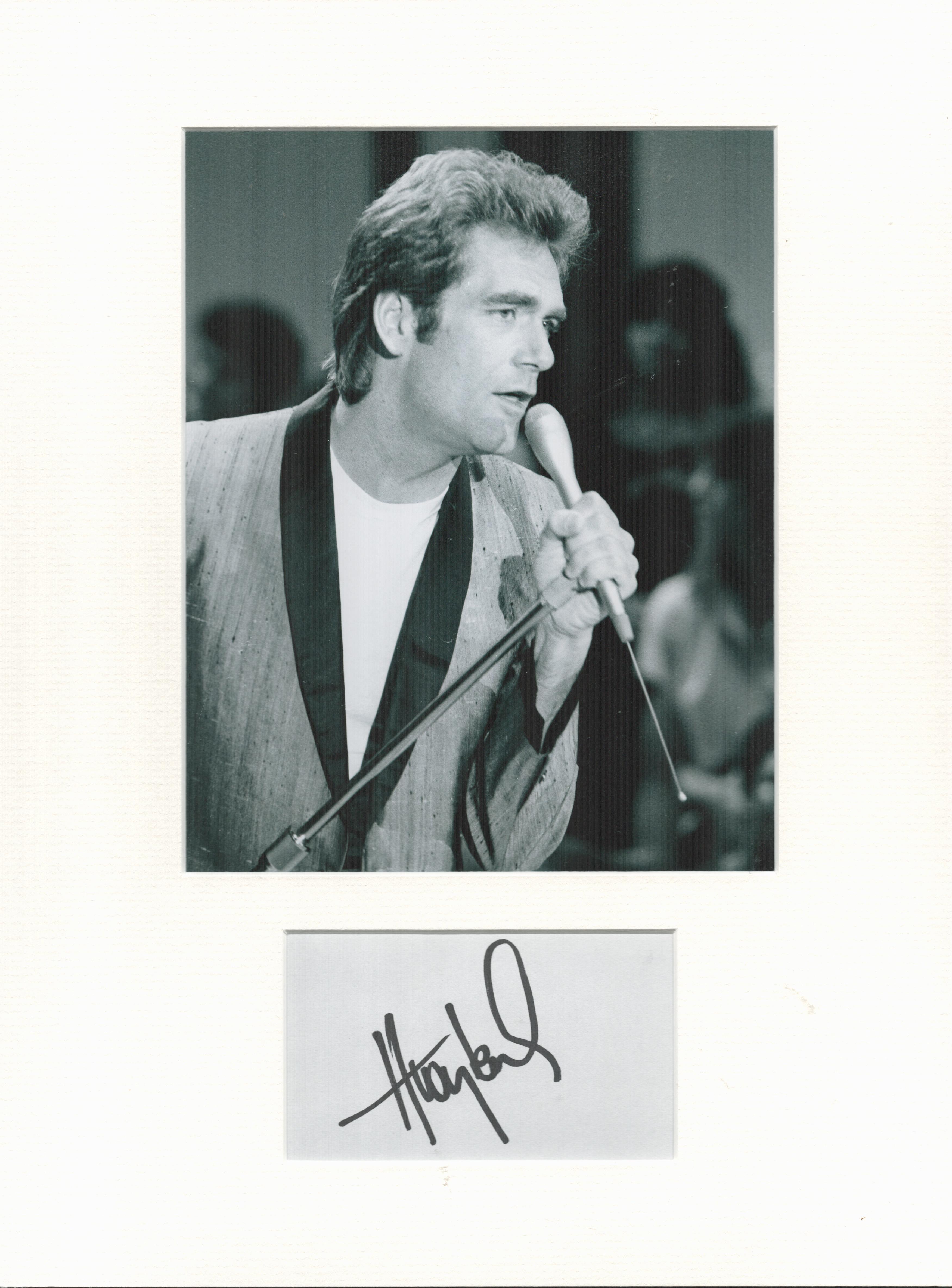 Huey Lewis music, signature piece autograph presentation. Mounted with unsigned photo to approx.