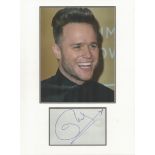 Olly Murs music, signature piece autograph presentation. Mounted with unsigned photo to approx. 16 x