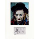 Boy George music signature piece autograph presentation. Mounted with unsigned photo to approx. 16 x