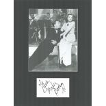 Mickey Rooney actor signature piece autograph presentation. Mounted with unsigned photo to approx.