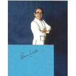 Ronnie Corbett Signed 6x4 Blue Card With 10 x 8 inch Colour Photo. Good condition. All autographs