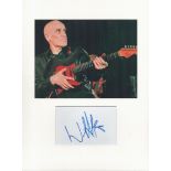 Wilko Johnson music, signature piece autograph presentation. Mounted with unsigned photo to