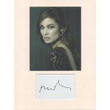 Berenice Marlohe signature piece autograph presentation. Mounted with unsigned photo to approx. 16 x