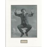 Norman Wisdom signature piece autograph presentation. Mounted with unsigned photo to approx. 16 x 12