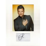 Peter Andre music, signature piece autograph presentation. Mounted with unsigned photo to approx. 16