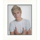 Niall Horan music signature piece autograph presentation. Mounted with unsigned photo to approx.