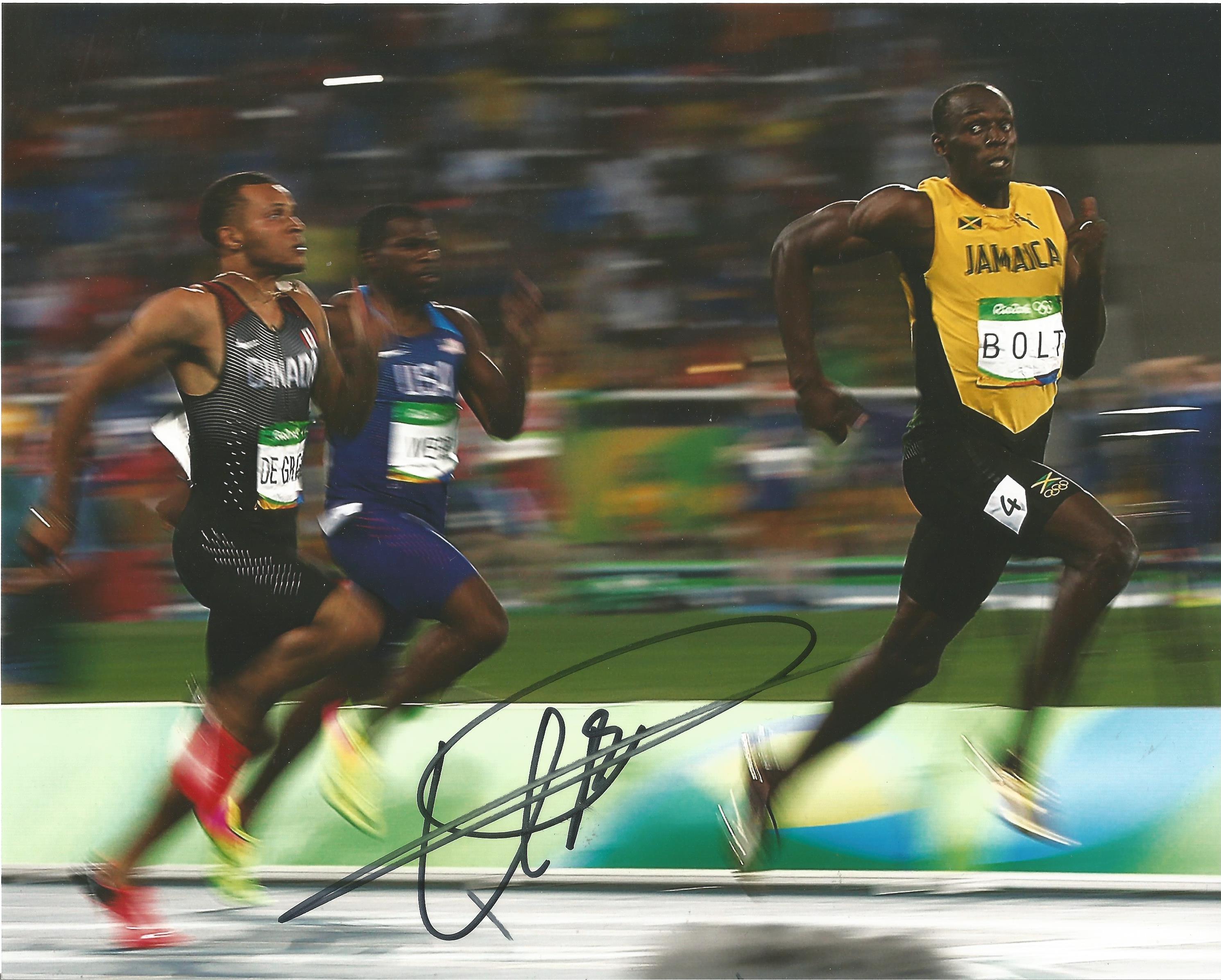 Athletics Usain Bolt signed 10 x 8 inch colour photo in action.