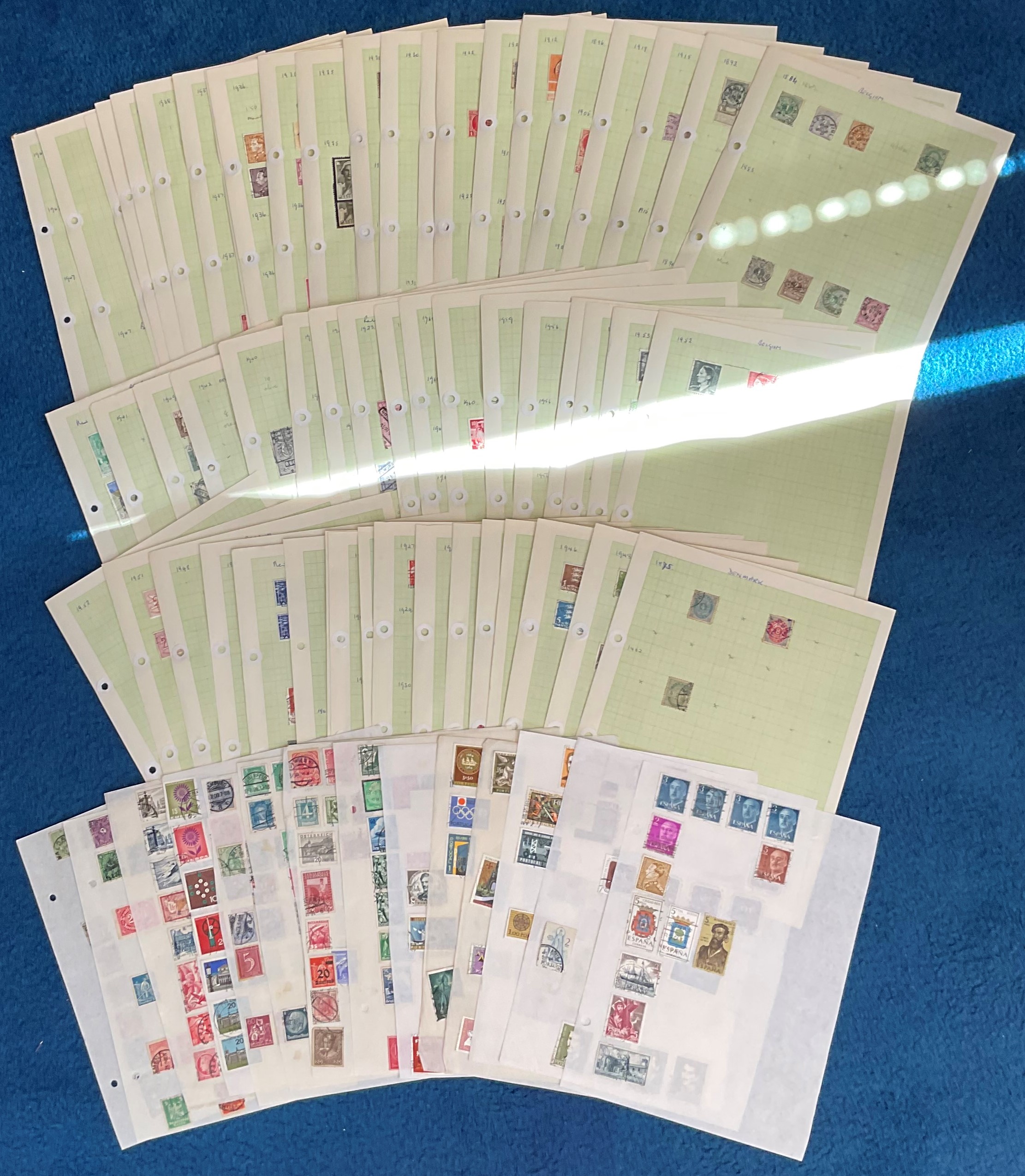 Assorted stamp collection. 59 loose pages. Includes Denmark, Belgium, Portugal, Spain, Austria,