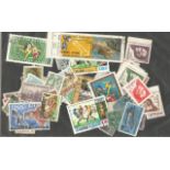 International, loose stamps on and off paper, approx. 100. Good condition. We combine postage on