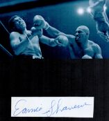Boxing, Earnie Shavers signature piece featuring a black and white photo and a signed card mounted