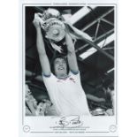 Football. Billy Bonds Signed 16x12 black and white photo with claret and blue around edges of shirt.