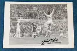 Norman Hunter signed 20x13 black and white print Norman Bite Yer Legs Hunter leaps for joy as