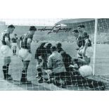 Football. Harry Gregg Signed 10x8 black and white photo. Photo shows Gregg Injured during a match.