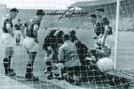 Football. Harry Gregg Signed 10x8 black and white photo. Photo shows Gregg Injured during a match.