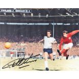 Football. Geoff Hurst Signed 10x8 colour photo. Photo shows the Hurst Shooting for goal against West