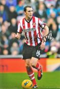 Football John O'Shea signed Sunderland 12x8 colour photo. John Francis O'Shea (born 30 April 1981)