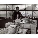 Doctor Who 8x10 scene photo signed by the late actor Rodney Bewes. Good condition. All autographs