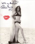 007 Bond girl Caroline Munro signed and physically kissed photo to leave a lipstick mark upon it.