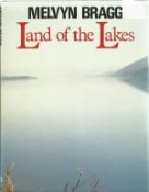 Melvyn Bragg signed hardback book Land of the Lakes. Good condition. All autographs come with a