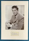Victor Mature signature piece mounted below b/w photo. Approx overall size 15x11. Good condition.