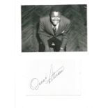 Oscar Peterson signature piece below black and white photo. Good condition. All autographs come with
