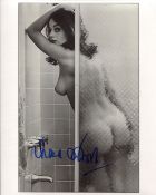 007 Bond girl Lana Wood signed photo, desirable image of her naked in the shower. Good condition.