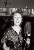 Dame Vera Lynn signed 8x12 inch photo of this WWII Forces Sweetheart in concert!. Good condition.