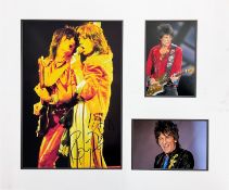 Ronnie Wood signed 18x15 mounted Rolling Stones colour photo and two unsigned photos. Ronald David