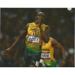 Usain Bolt signed 10x8 colour photo pictured in action in London 2012 Olympics. Jamaican sprinter,