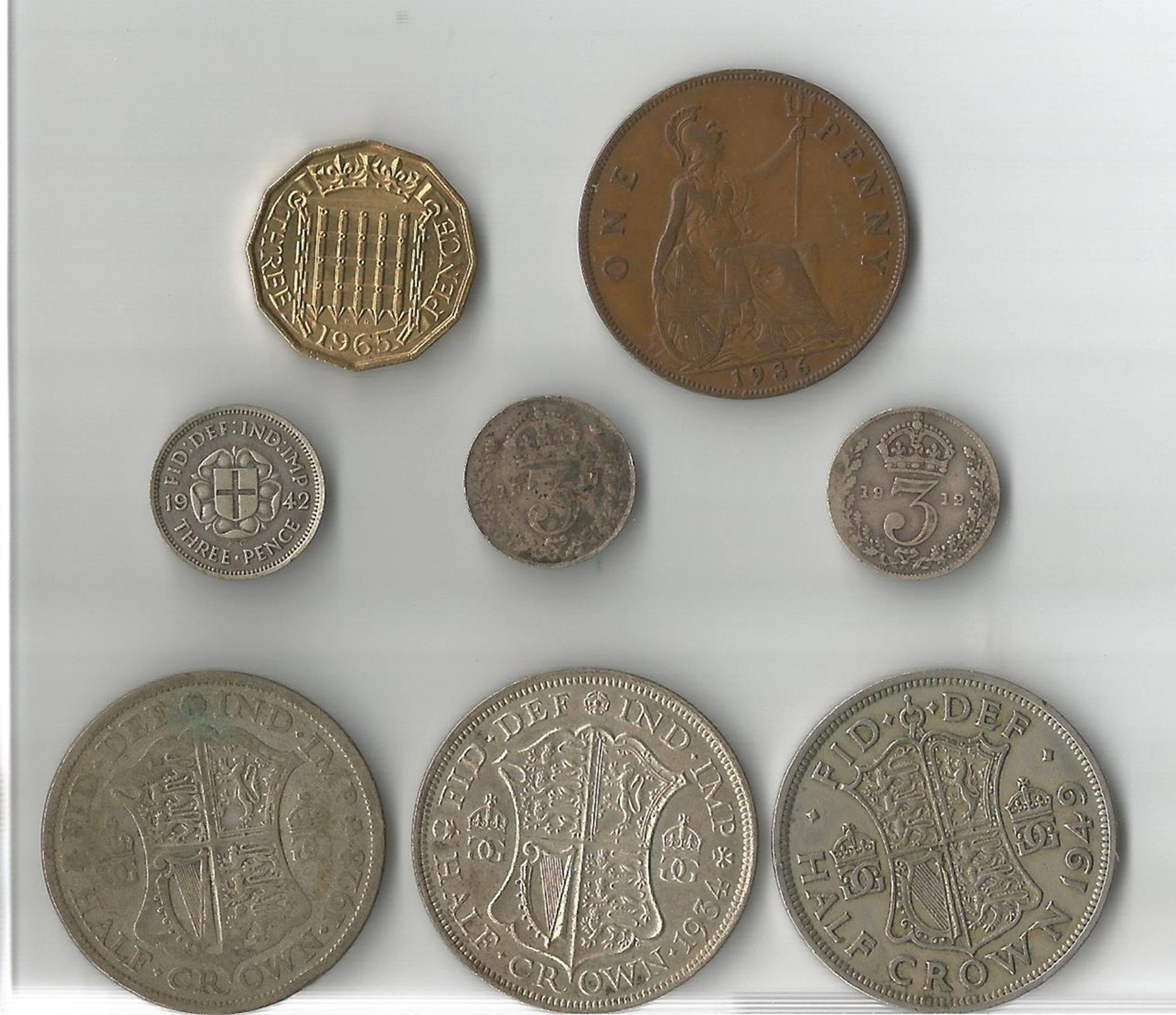 3 x Half Crowns, 1928, 1934, 1949, 3 x Silver Three Pence, 1912, 1917, 1942, Brass Three Pence,