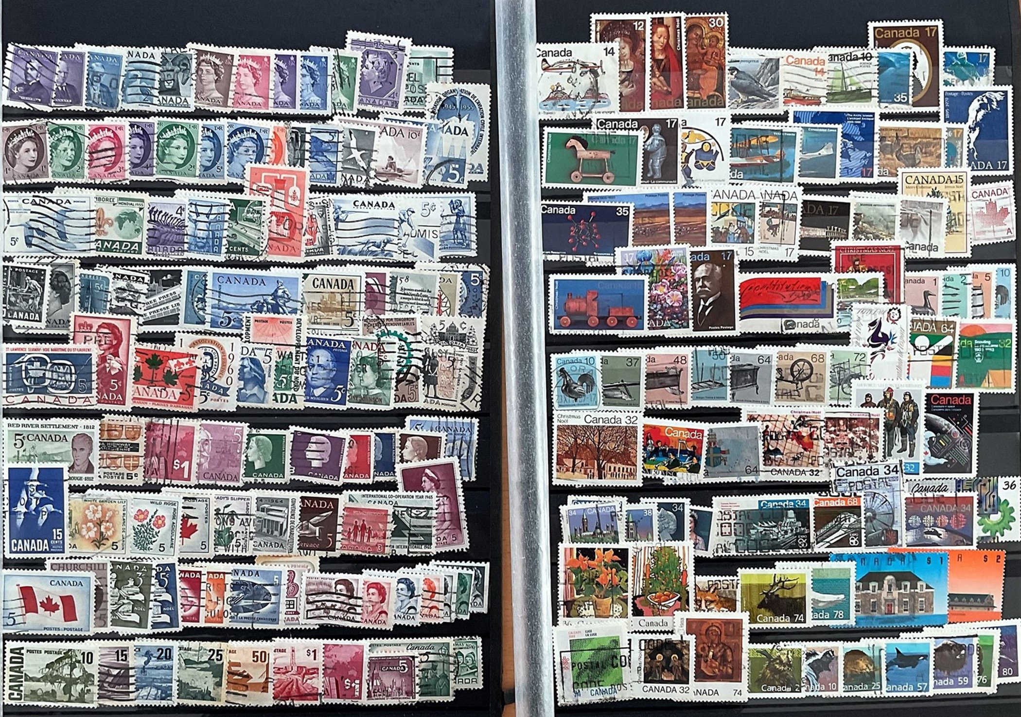 Canada used Stamps on 2 hardback Album pages with 9 rows each side, approx 300 Stamps. Good