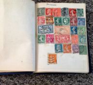 Vintage stamp collection in hardback miniature album containing world stamps from late 1800s to