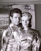 Lost in Space 8x10 photo signed by Mark Goddard and Marta Kristen. Good condition. All autographs