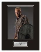 Stunning Display! Vikings Travis Fimmel hand signed professionally mounted display. This beautiful