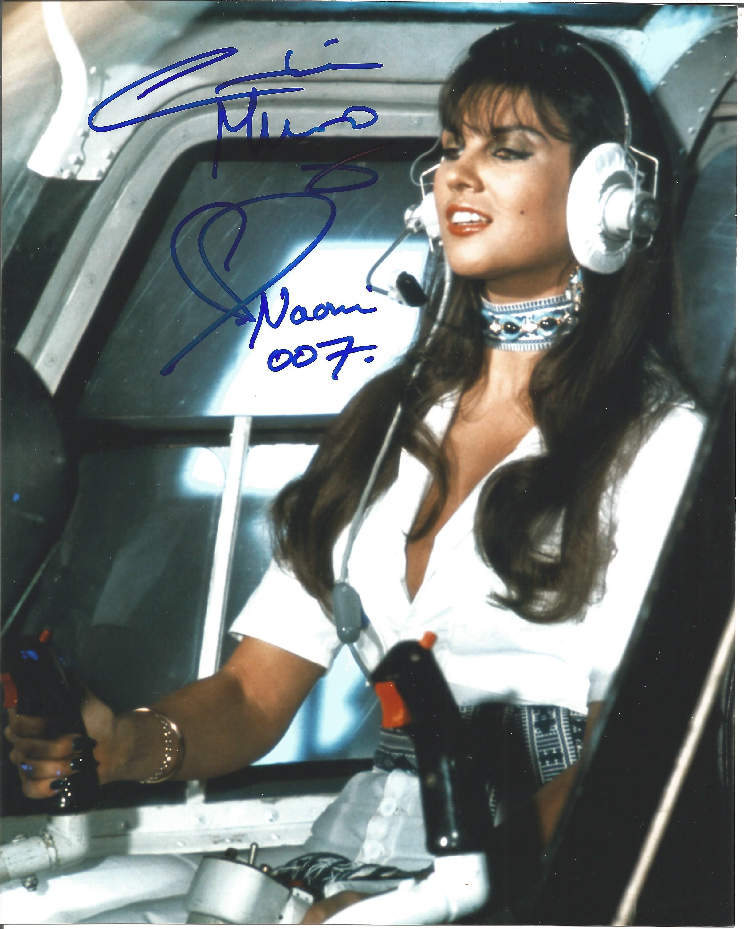 Caroline Munro Handsigned 10x8 Colour photo. Photo shows Munro in a Helicopter Scene during Bond
