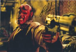 Ron Pearlman Hellboy Actor Handsigned 12x8 Colour Photo. Photo shows Hellboy from a scene from the
