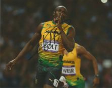 Usain Bolt retired Jamaican sprinter 10x8 signed colour photo. Good condition. All autographs come