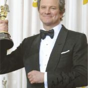 Colin Firth signed 12x8 colour photo with Oscar trophy. Good condition. All autographs come with a